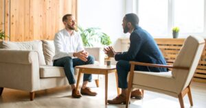 How Highly Sensitive People Can Set Healthy Emotional Boundaries Without Feeling Guilty two men calmly talking